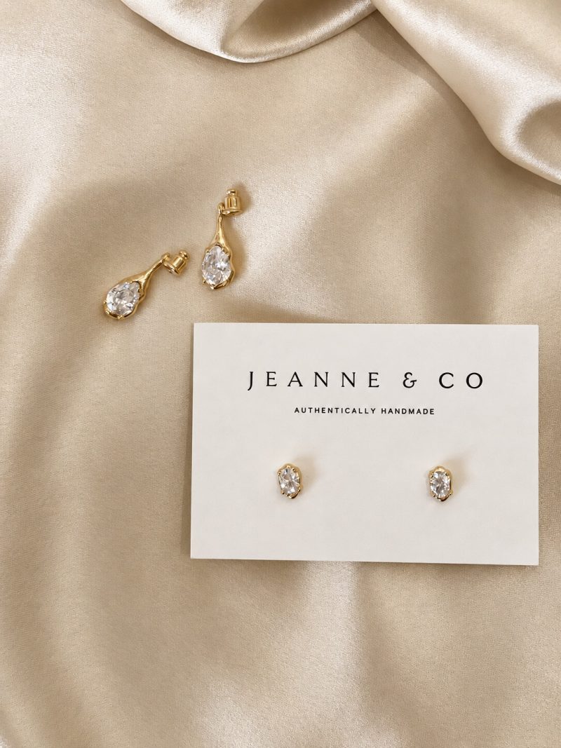 The Sidonie Earrings 2 Close-up of the Sidonie Earrings, oval and teardrop zircon stones in softly sculpted settings