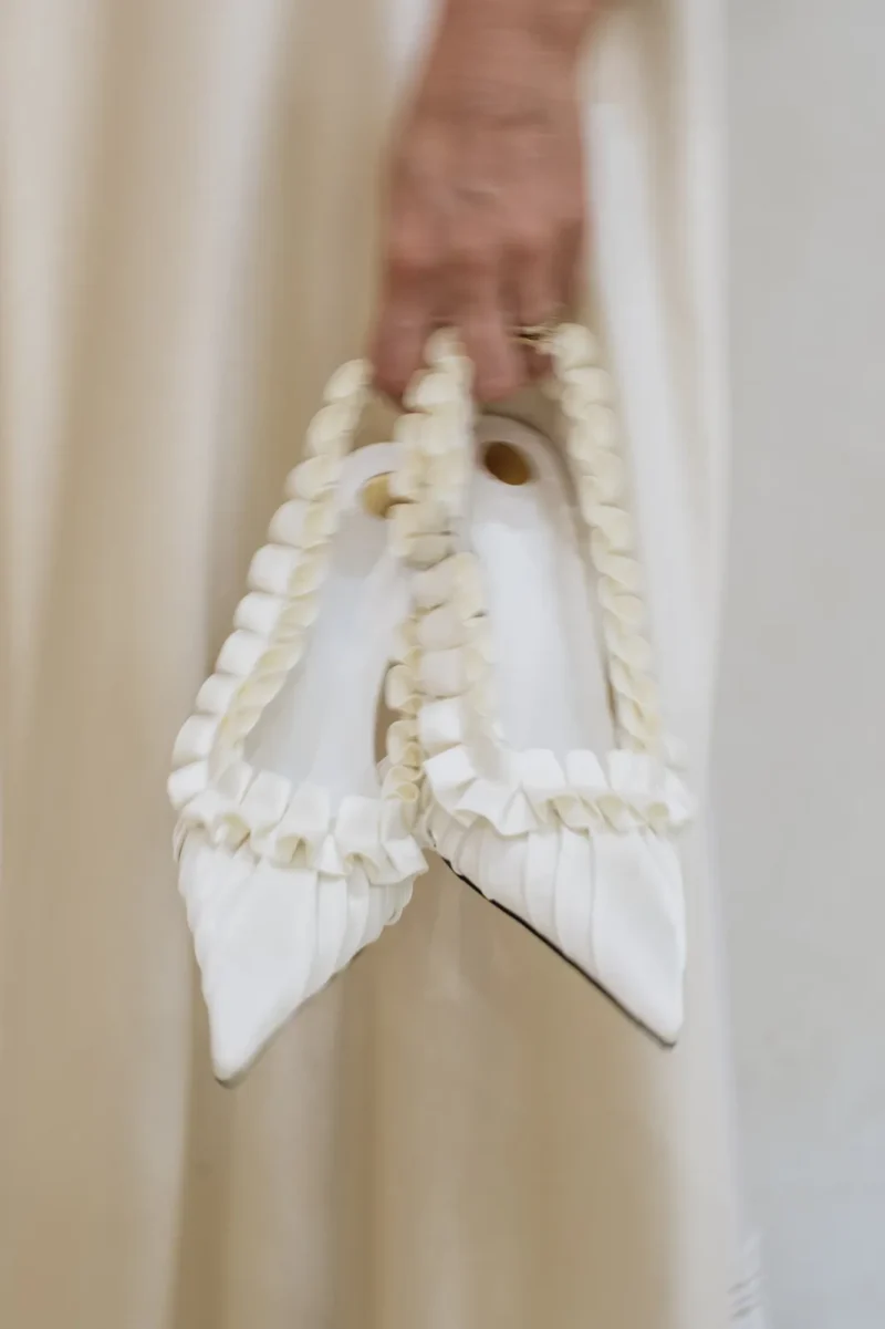 odette-ruffle-satin-slingback-in-hand