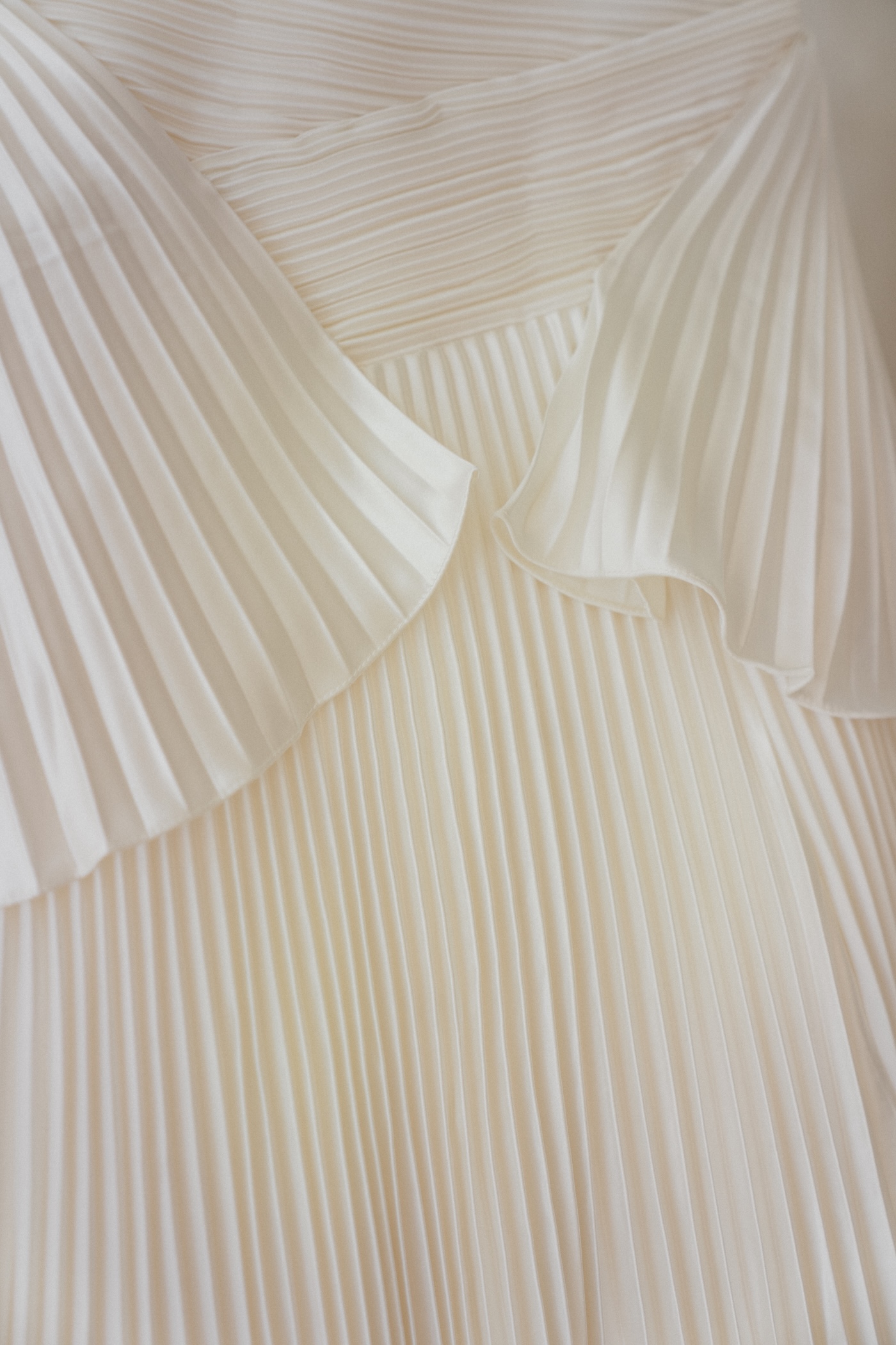 Detail of a pleated bridal gown